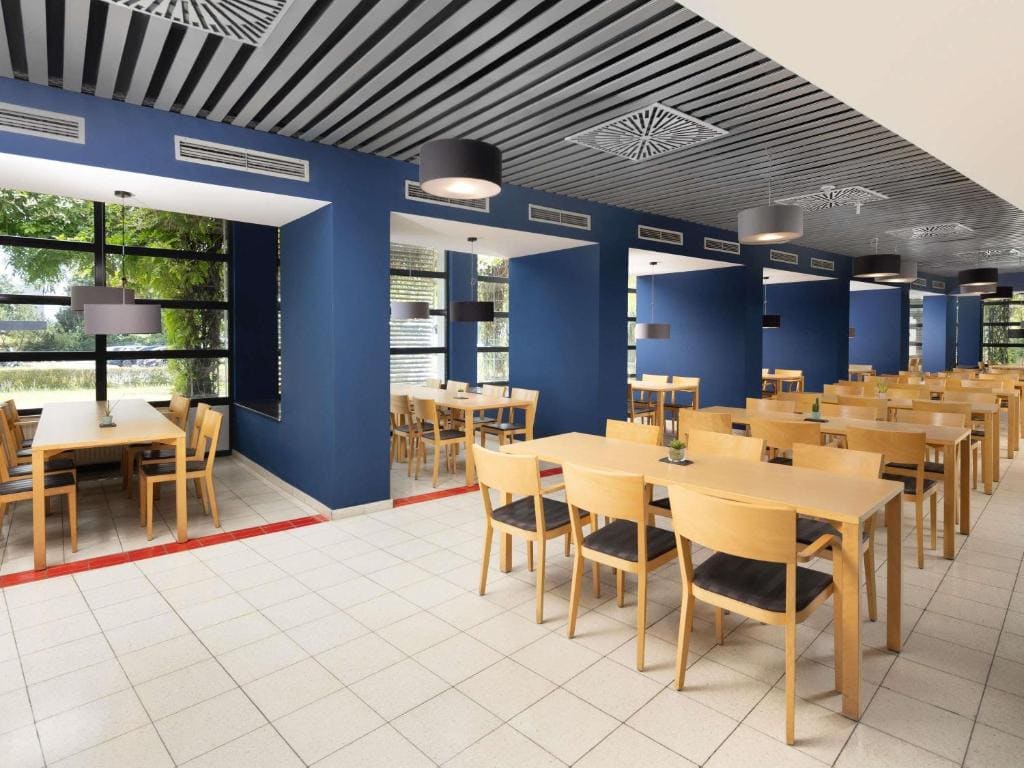 Breakfast area with tables and blue walls